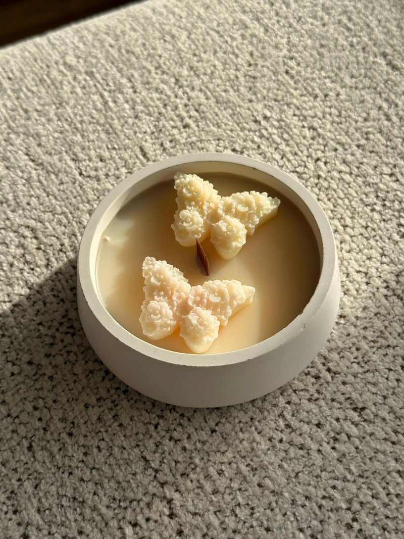 Handmade soy candle with floral wax melts in white ceramic bowl, Scandinavian home decor
