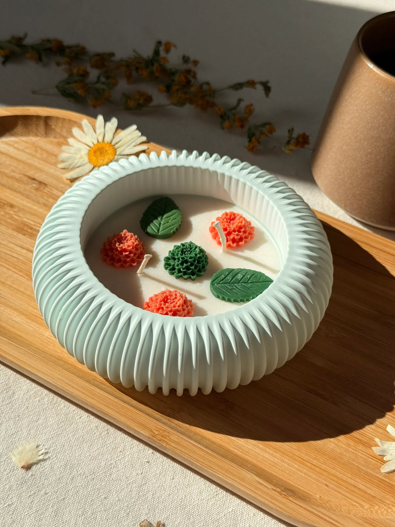 Handmade soy candle with floral wax blooms in mint ceramic bowl, Scandinavian home decor