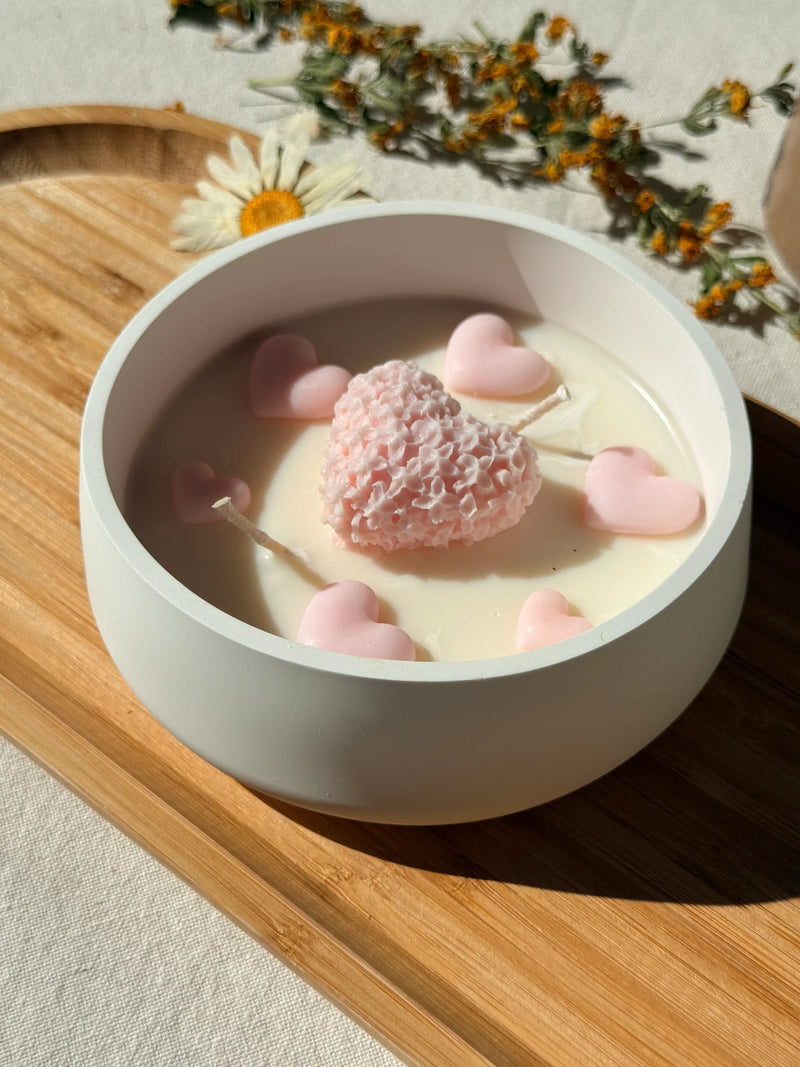 Handmade soy candle with pink heart wax melts in white bowl, Scandinavian home decor
