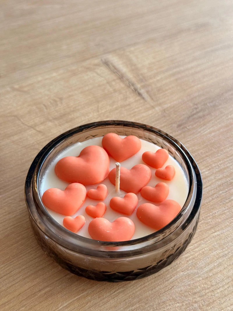 Handmade soy candle with coral hearts in glass jar, Scandinavian home decor