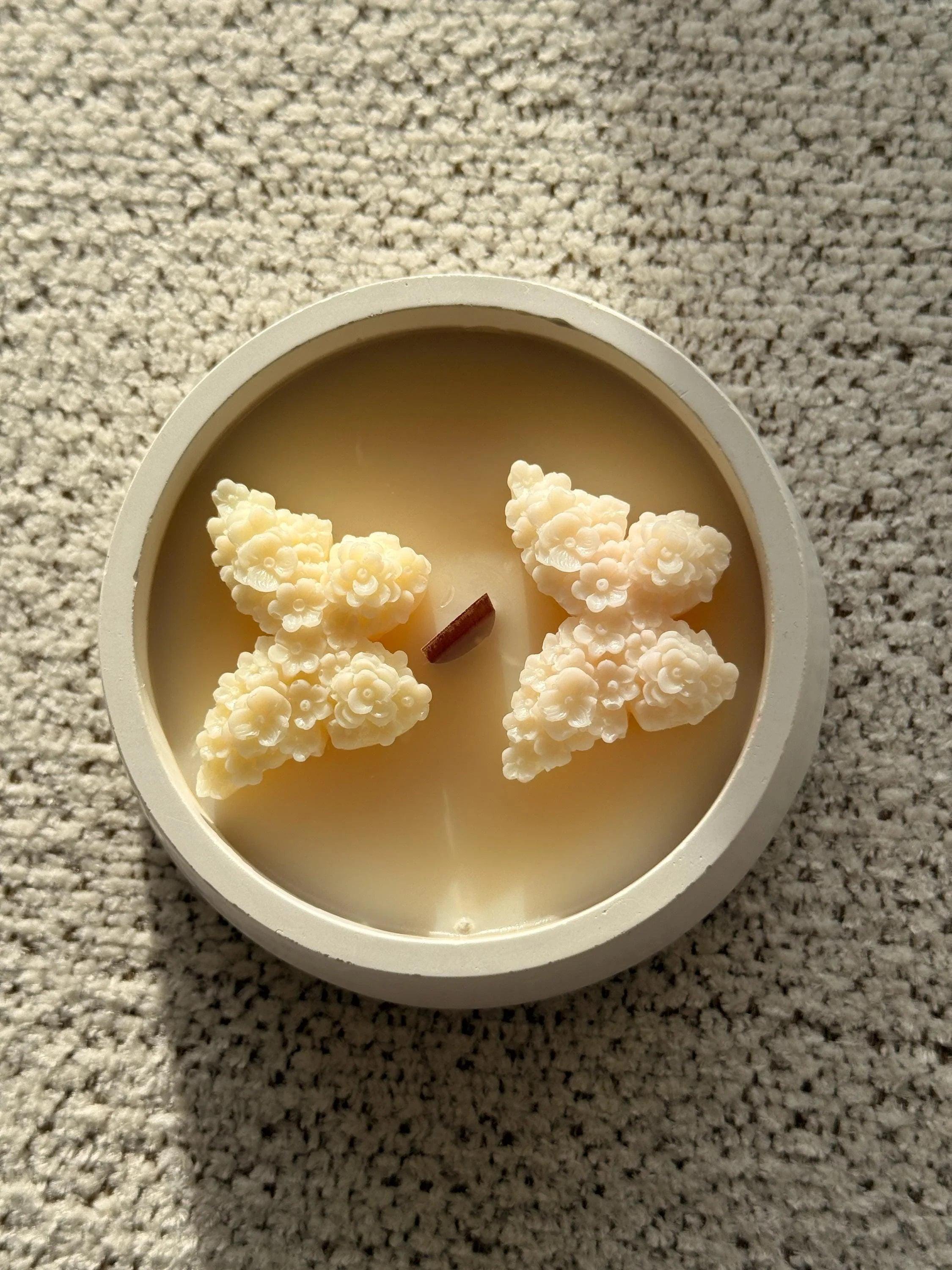 Handmade soy candle with floral wax art, Scandinavian home décor, cozy ambiance