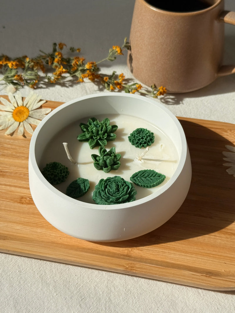 Handmade soy candle with green succulent and leaf designs, perfect for Scandinavian home décor and cozy living.