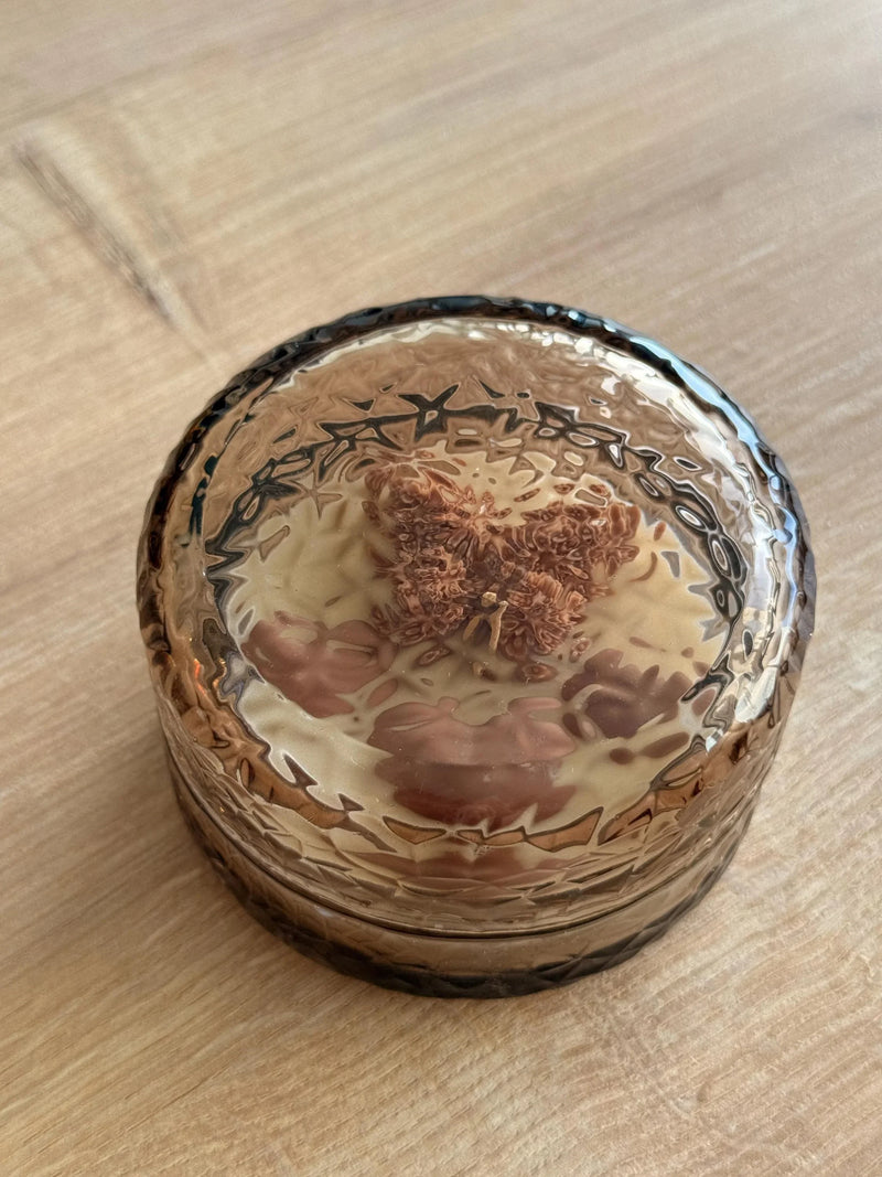 Handmade soy candle in textured amber glass jar, Scandinavian home decor, cozy ambiance
