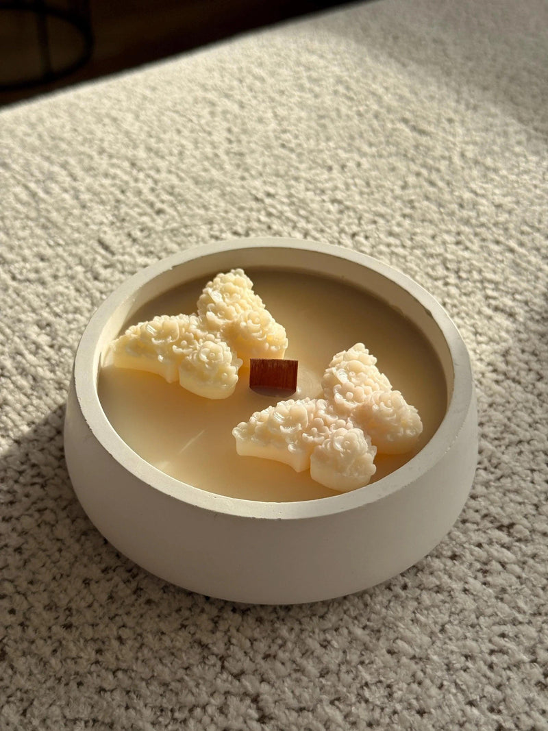 Handmade soy candle with floral wax melts in white ceramic bowl, Scandinavian home decor