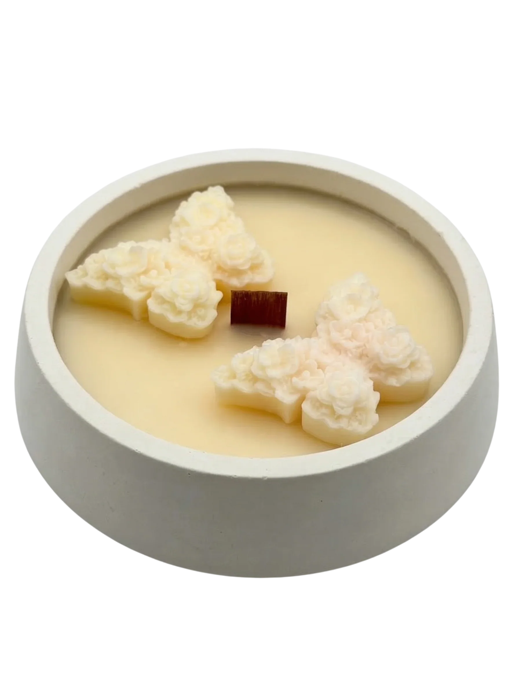 Handmade soy candle with floral wax accents in a minimalist concrete bowl, Scandinavian home décor