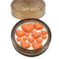 Handmade soy candle with orange heart wax melts in textured glass jar, Scandinavian home décor