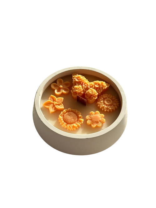 Handmade soy candle with orange flower wax melts in a ceramic bowl, Scandinavian home decor