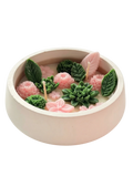 Handmade soy candle with pink flowers and green succulents in a ceramic bowl, Scandinavian home decor