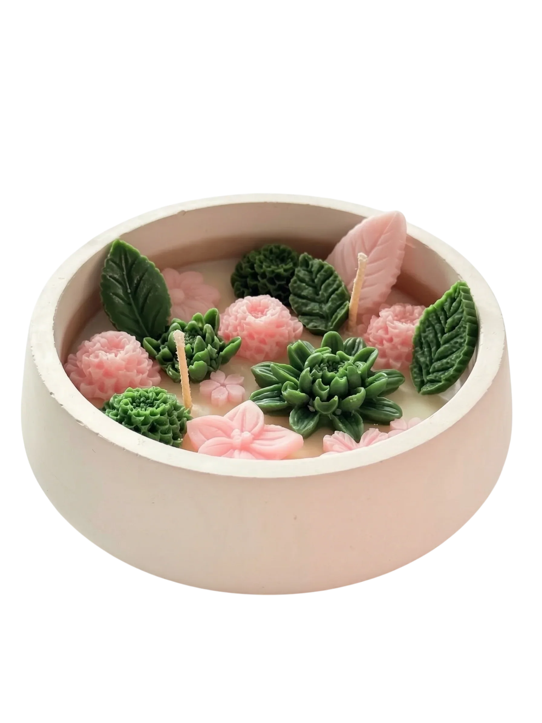 Handmade soy candle with pink flowers and green succulents in a ceramic bowl, Scandinavian home decor