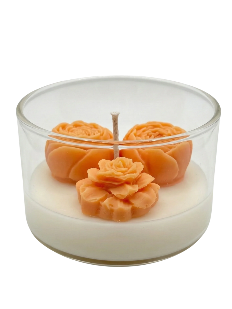 Handmade soy candle with orange rose wax flowers in clear glass jar, Scandinavian home décor