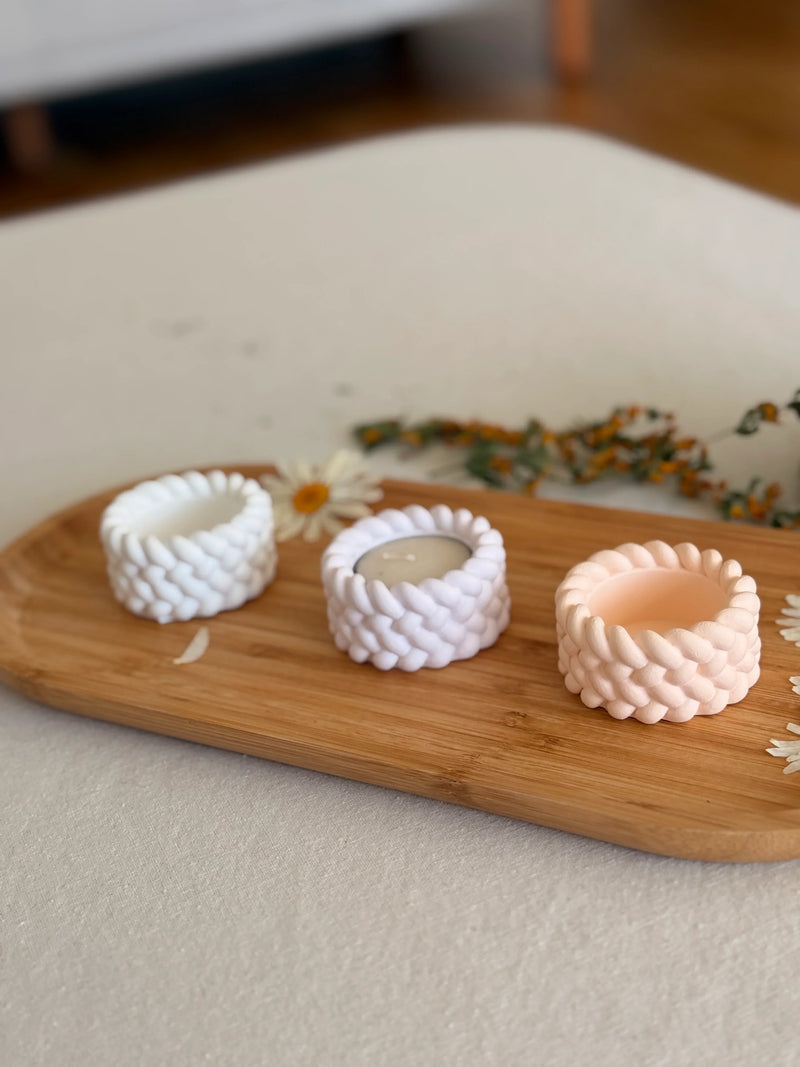 Handmade knit-textured soy candle holders in white and blush, Scandinavian home decor on wooden tray