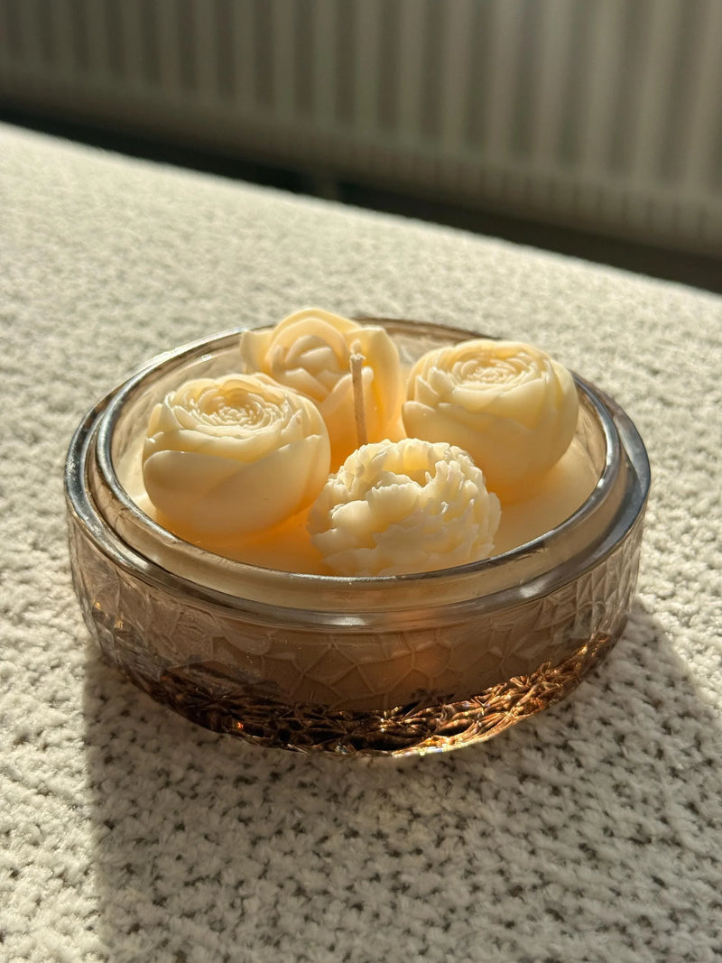 Handmade soy candle with rose and peony wax flowers in a vintage glass jar, Scandinavian home décor