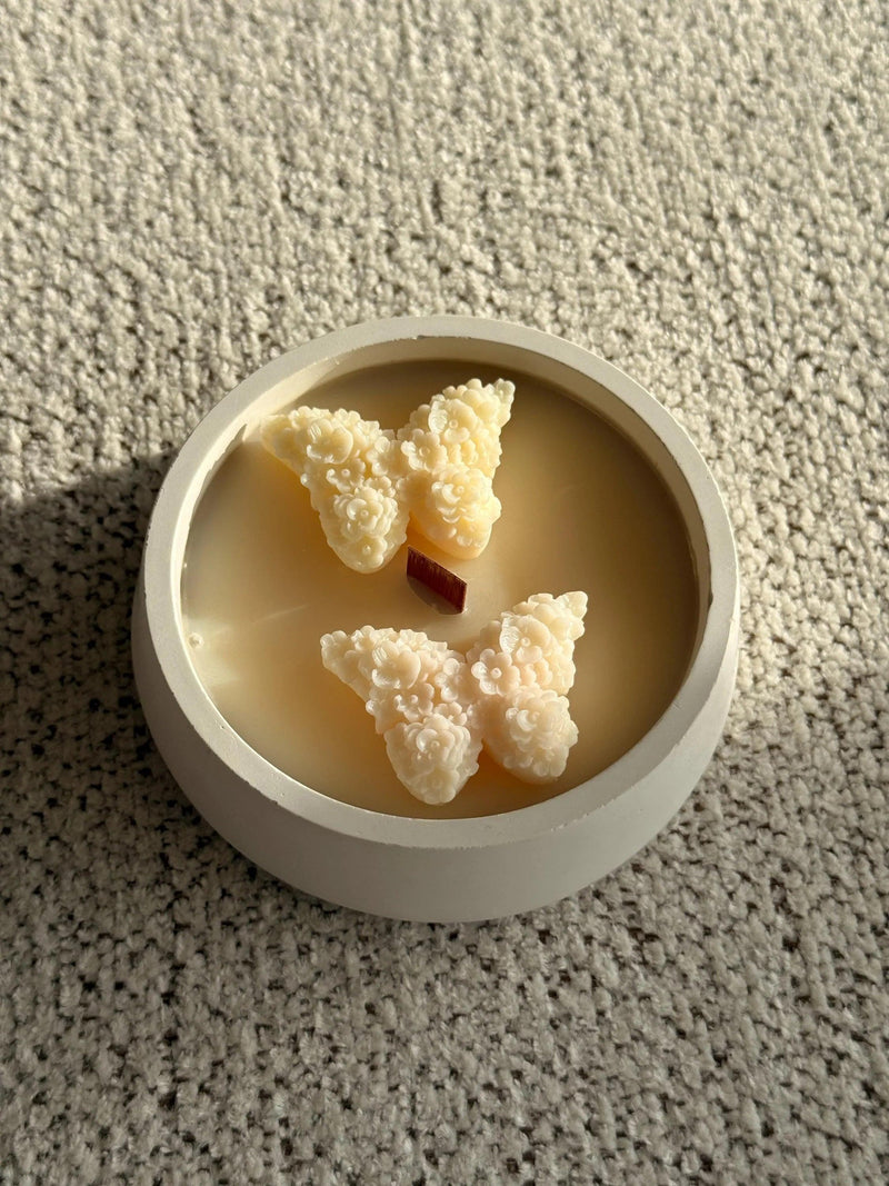 Handmade soy candle with floral wax butterflies in white ceramic, Scandinavian home decor