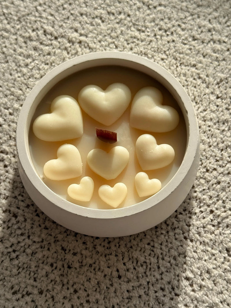 Heart-shaped soy wax melts in white ceramic dish, cozy Scandinavian home decor